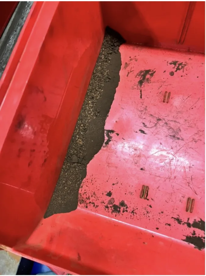 Iron-rich sludge captured in the filter housing after HydroFlux treatment